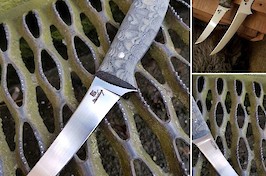 Custom boning knife for doing carcass butchering, made in Sandvik 14C28N and black canvas micarta