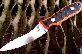 Customised gralloching knife realised in RWL34 with layered black/orange G10 scales